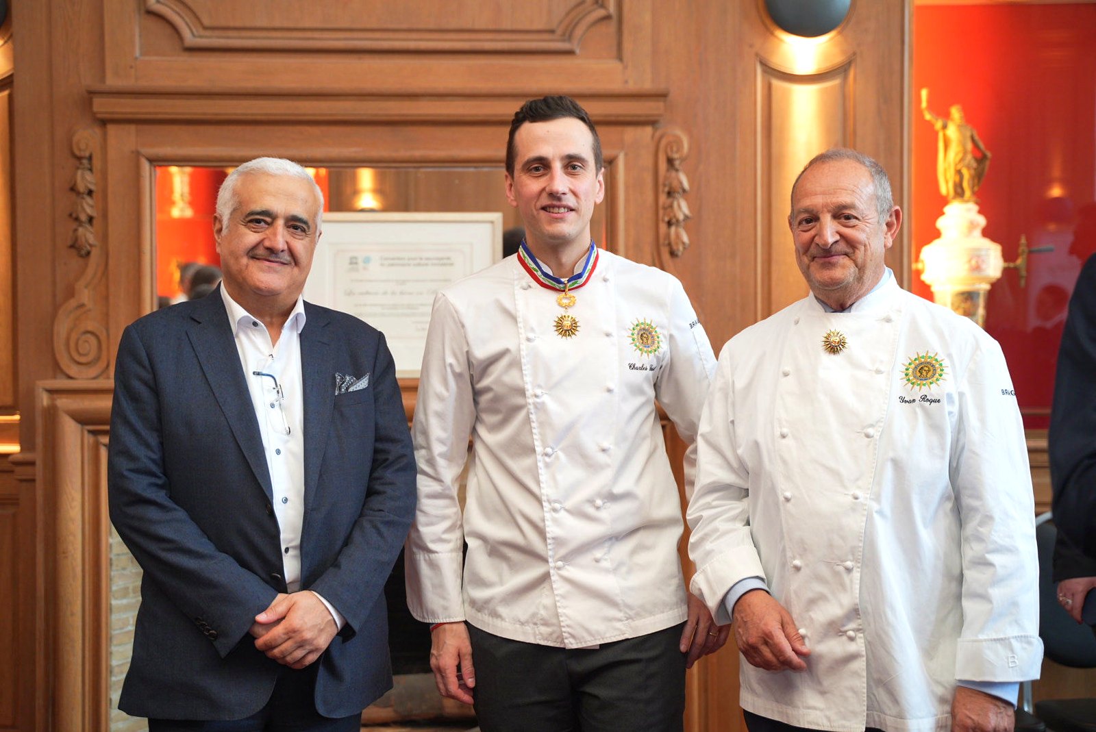 Chef Charles Sassiat with chef Yvan Roque and a guest at the Brewers House