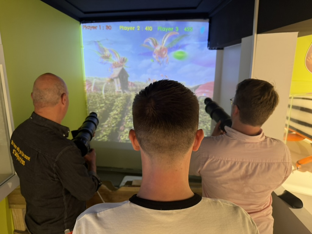 Visitors playing with an interactive installation at Friet Museum Brussels
