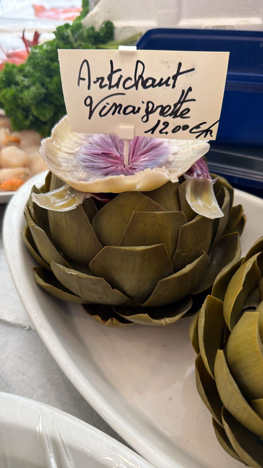 Whole artichoke vinaigrette at 12 euros on the counter