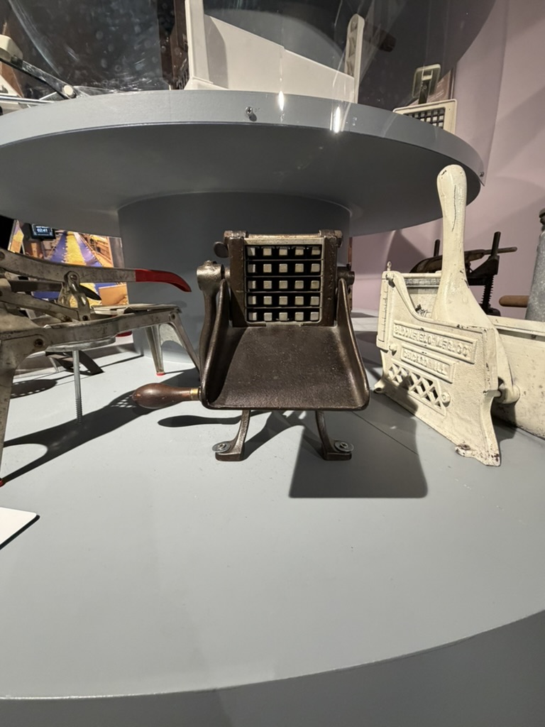 Antique cast iron fry cutters displayed at the Friet Museum Brussels