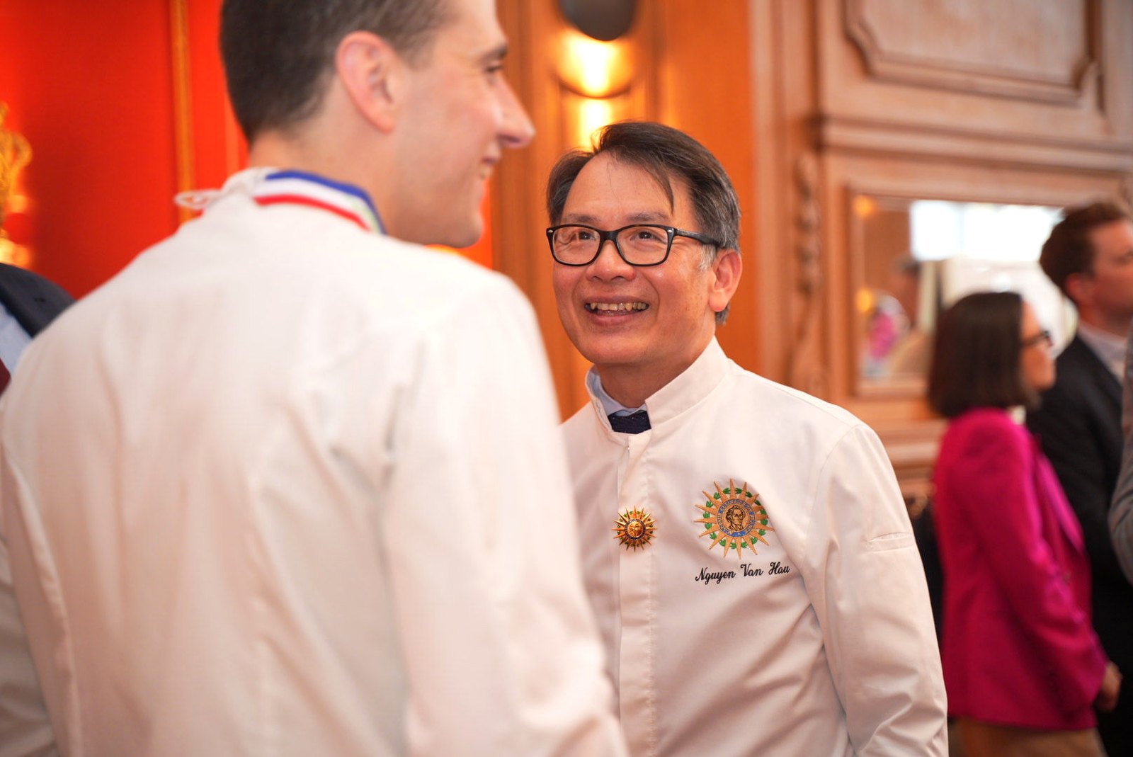 Chef Nguyen Van Hau wearing the Académie Culinaire de France jacket