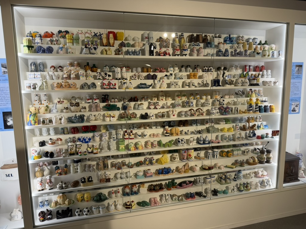 Display case full of collectible salt and pepper shakers at the Friet Museum