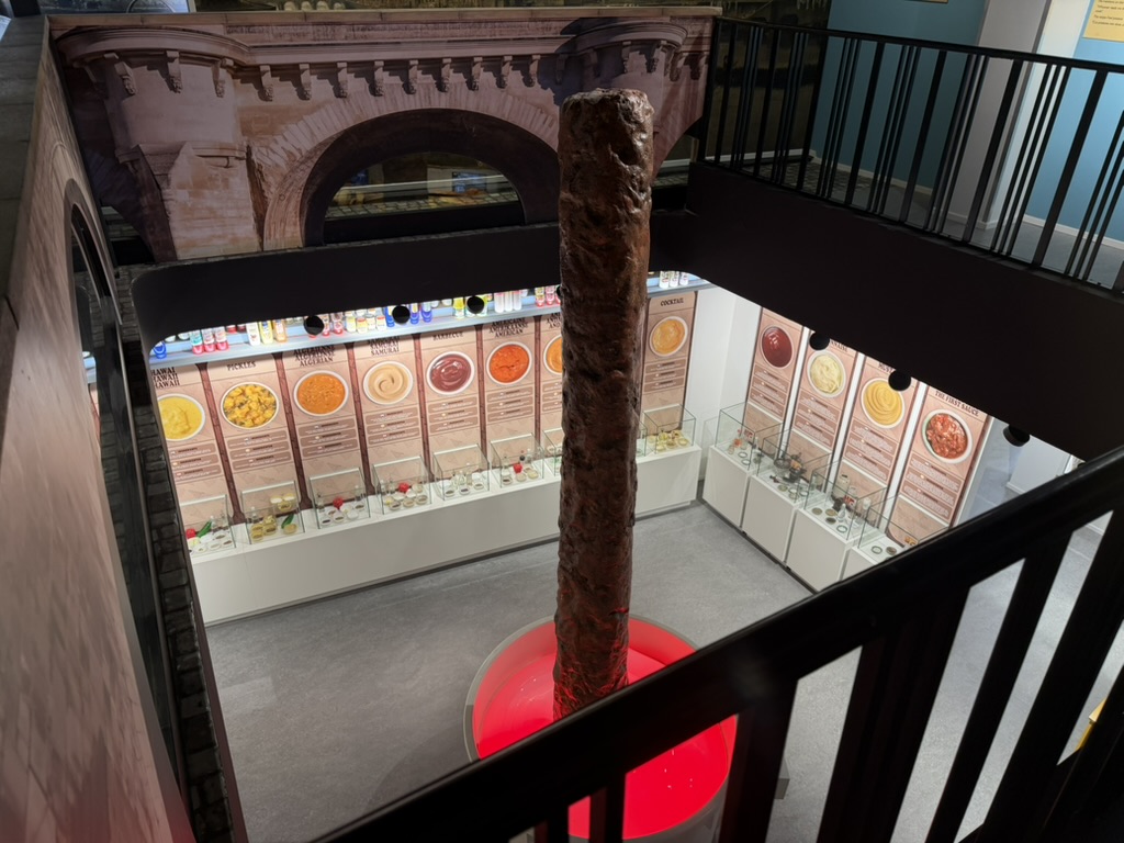 Wall of Belgian sauces seen from the upper floor of the Friet Museum